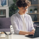 Stay at home mom working on a laptop during child's nap time