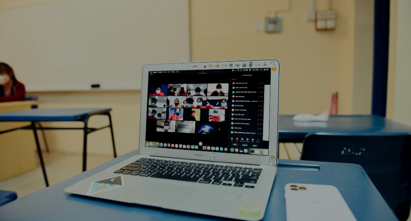 Teacher tutoring a student online as one of the top side hustles for teachers