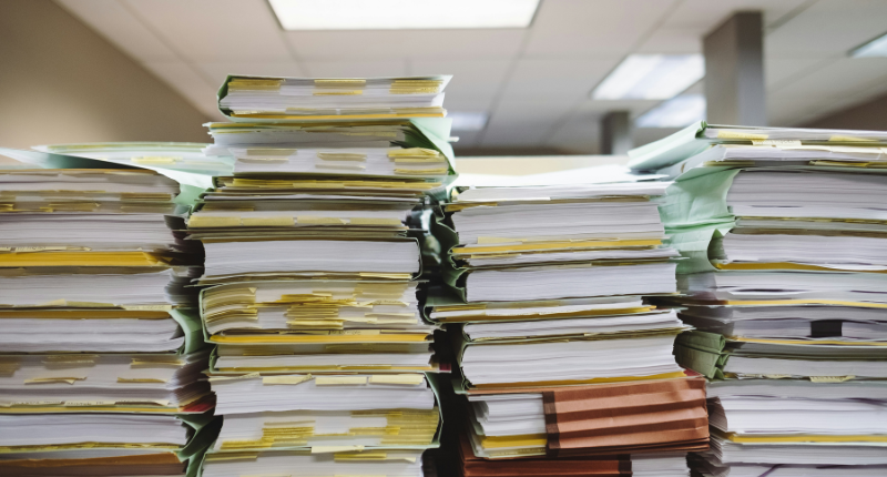 Stack of graded papers representing AP exam grading side income