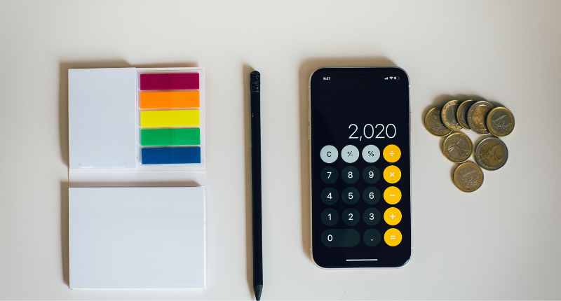Budget notebook and coins representing realistic side hustle income for teachers