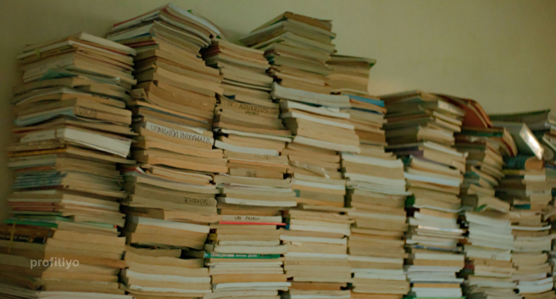 Stack of used textbooks to save money in college